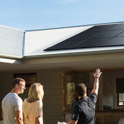 Couple getting a free in-home solar assessemnt form a Solahart dealer.